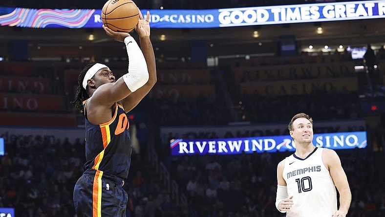 Mar 10, 2024; Oklahoma City, Oklahoma, USA; Oklahoma City Thunder guard Luguentz Dort (5) shoots a three point basket against the Memphis Grizzlies during the second quarter at Paycom Center. Mandatory Credit: Alonzo Adams-USA TODAY Sports