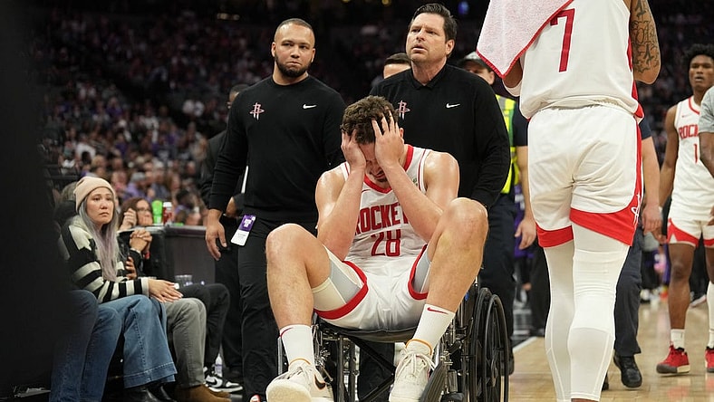 Mar 10, 2024; Sacramento, California, USA; Houston Rockets center Alperen Sengun (28) is wheeled off of the court after suffering an injury against the Sacramento Kings during the fourth quarter at Golden 1 Center. Mandatory Credit: Darren Yamashita-USA TODAY Sports