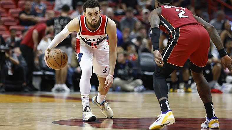 Mar 10, 2024; Miami, Florida, USA; Miami Heat guard Terry Rozier (2) defends Washington Wizards guard Tyus Jones (5) during the second half at Kaseya Center. Mandatory Credit: Rhona Wise-USA TODAY Sports