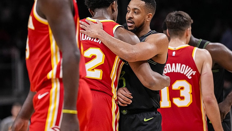 Mar 10, 2024; Atlanta, Georgia, USA; Atlanta Hawks forward De'Andre Hunter (12) and New Orleans Pelicans guard CJ McCollum (3) react together after the game at State Farm Arena. Mandatory Credit: Dale Zanine-USA TODAY Sports