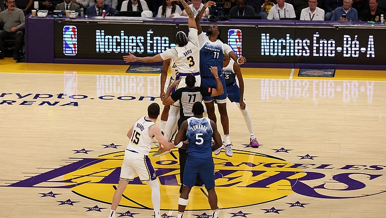 Mar 10, 2024; Los Angeles, California, USA;  Los Angeles Lakers forward Anthony Davis (3) and Minnesota Timberwolves center Naz Reid (11) tip off during the first quarter at Crypto.com Arena. Mandatory Credit: Kiyoshi Mio-USA TODAY Sports