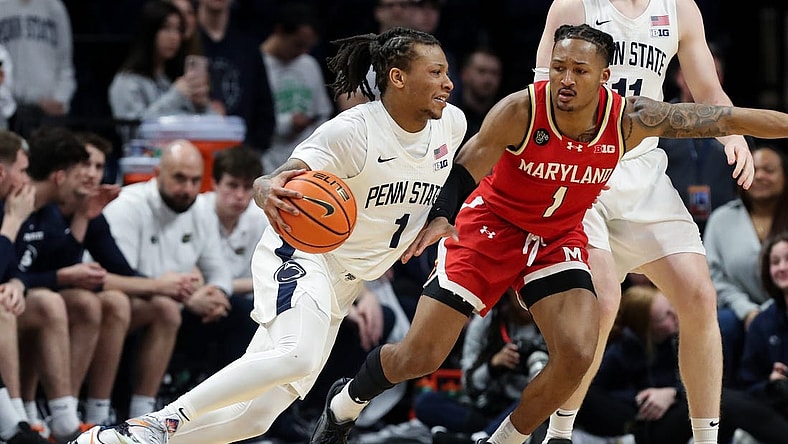 Mar 10, 2024; University Park, Pennsylvania, USA; Penn State Nittany Lions guard Ace Baldwin Jr (1) dribbles the ball toward the basket as Maryland Terrapins guard Jahmir Young (1) defends during the second half at Bryce Jordan Center. Penn State defeated Maryland 85-69. Mandatory Credit: Matthew O'Haren-USA TODAY Sports