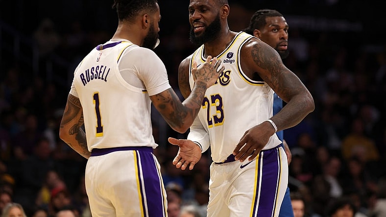 Mar 10, 2024; Los Angeles, California, USA;  Los Angeles Lakers forward LeBron James (23) greets guard D'Angelo Russell (1) after Russell scored a basket during the second quarter against the Minnesota Timberwolves at Crypto.com Arena. Mandatory Credit: Kiyoshi Mio-USA TODAY Sports