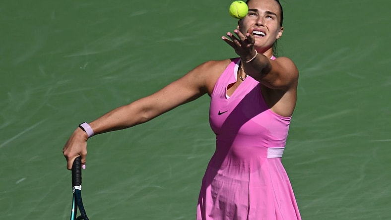 Mar 11, 2024; Indian Wells, CA, USA; Aryna Sabalenka hits a serve in her third round match against Emma Raducanu (GBR) during the BNP Paribas Open at Indian Wells Tennis Garden. Mandatory Credit: Jonathan Hui-USA TODAY Sports