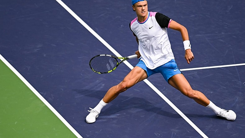 Mar 11, 2024; Indian Wells, CA, USA; Holger Rune (DEN) hits a shot in his third round match against Lorenzo Musetti (ITA) during the BNP Paribas Open at Indian Wells Tennis Garden. Mandatory Credit: Jonathan Hui-USA TODAY Sports