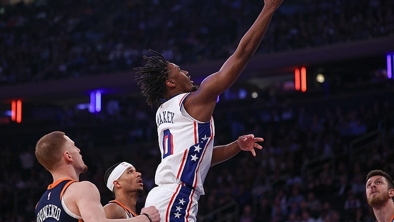 Mar 12, 2024; New York, New York, USA; Philadelphia 76ers guard Tyrese Maxey (0) shoots the ball against the New York Knicks New York Knicks guard Donte DiVincenzo (0) during the first quarter at Madison Square Garden. Mandatory Credit: Vincent Carchietta-USA TODAY Sports