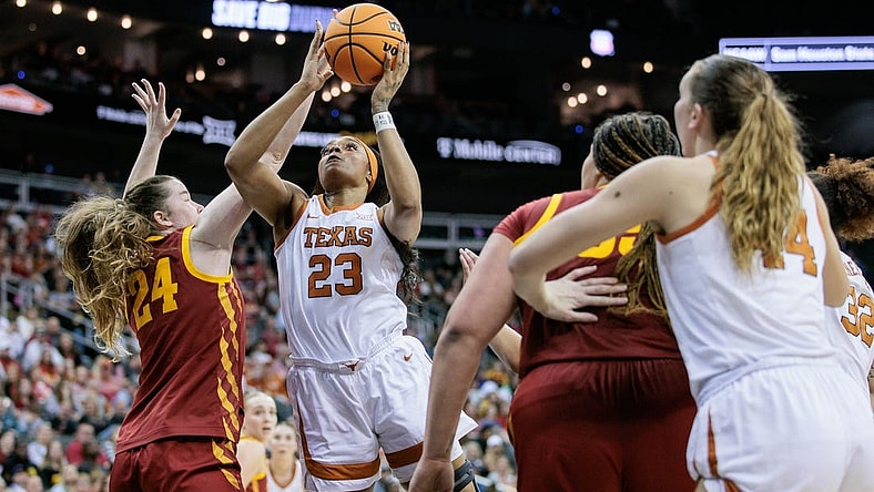 Mar 12, 2024; Kansas City, MO, USA; Texas Longhorns forward Aaliyah Moore (23) shoots the ball over Iowa State Cyclones forward Addy Brown (24) during the first half at T-Mobile Center. Mandatory Credit: William Purnell-USA TODAY Sports