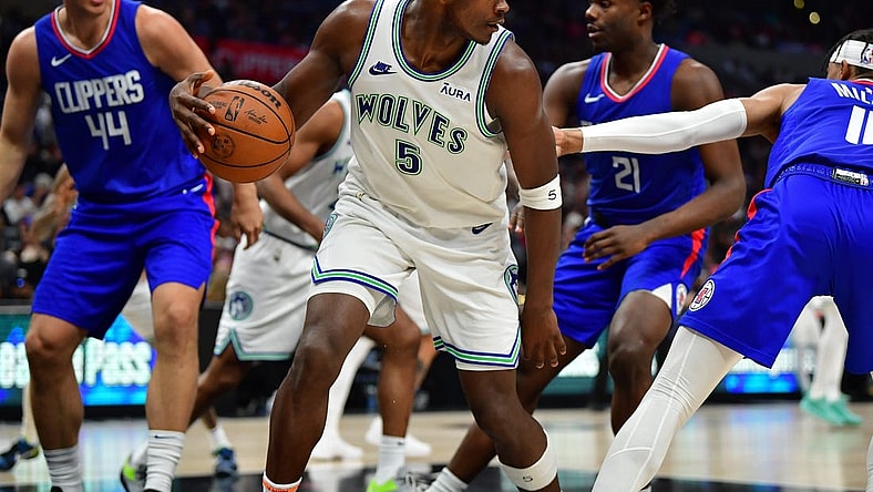 Mar 12, 2024; Los Angeles, California, USA; Minnesota Timberwolves guard Anthony Edwards (5) controls the ball against the Los Angeles Clippers during the second half at Crypto.com Arena. Mandatory Credit: Gary A. Vasquez-USA TODAY Sports