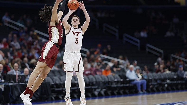 Mar 13, 2024; Washington, D.C., USA; Virginia Tech Hokies guard Sean Pedulla (3) shoots the ball as Florida State Seminoles guard Jalen Warley (1) defends in the first half at Capital One Arena. Mandatory Credit: Geoff Burke-USA TODAY Sports