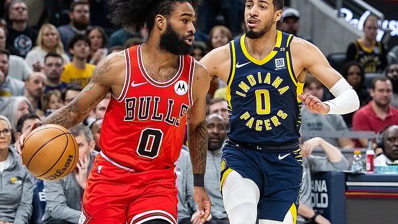 Mar 13, 2024; Indianapolis, Indiana, USA; Chicago Bulls guard Coby White (0) dribbles the ball while Indiana Pacers guard Tyrese Haliburton (0) defends in the first half at Gainbridge Fieldhouse. Mandatory Credit: Trevor Ruszkowski-USA TODAY Sports