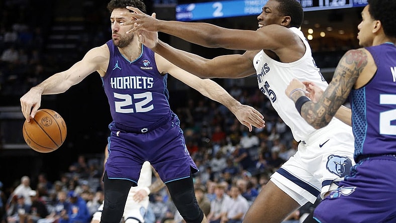 Mar 12, 2024; Memphis, Tennessee, USA; Charlotte Hornets guard Vasilije Micic (22) and Memphis Grizzlies center Trey Jemison (55) battle for a rebound during the first half at FedExForum. Mandatory Credit: Petre Thomas-USA TODAY Sports