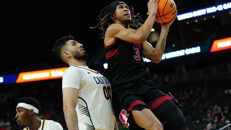 Mar 13, 2024; Las Vegas, NV, USA; Stanford Cardinal guard Kanaan Carlyle (3) shoots the ball against California Golden Bears forward Fardaws Aimaq (00) in the first half at T-Mobile Arena. Mandatory Credit: Kirby Lee-USA TODAY Sports