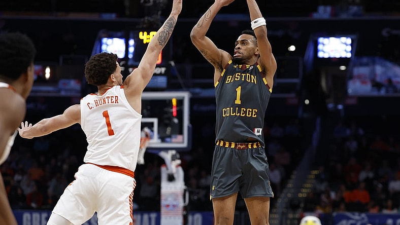 Mar 13, 2024; Washington, D.C., USA; Boston College Eagles guard Claudell Harris Jr. (1) shoots the ball over Clemson Tigers guard Chase Hunter (1) in the first half at Capital One Arena. Mandatory Credit: Geoff Burke-USA TODAY Sports