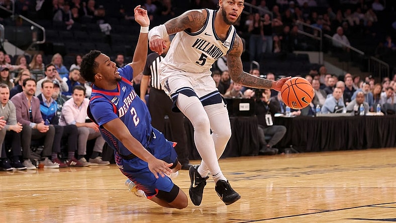 Mar 13, 2024; New York City, NY, USA; Villanova Wildcats guard Justin Moore (5) is fouled by DePaul Blue Demons guard Chico Carter Jr. (2) during the second half at Madison Square Garden. Mandatory Credit: Brad Penner-USA TODAY Sports