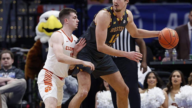Mar 13, 2024; Washington, D.C., USA; Boston College Eagles forward Quinten Post (12) dribbles the ball as Clemson Tigers guard Joseph Girard III (11) defends in the second half at Capital One Arena. Mandatory Credit: Geoff Burke-USA TODAY Sports