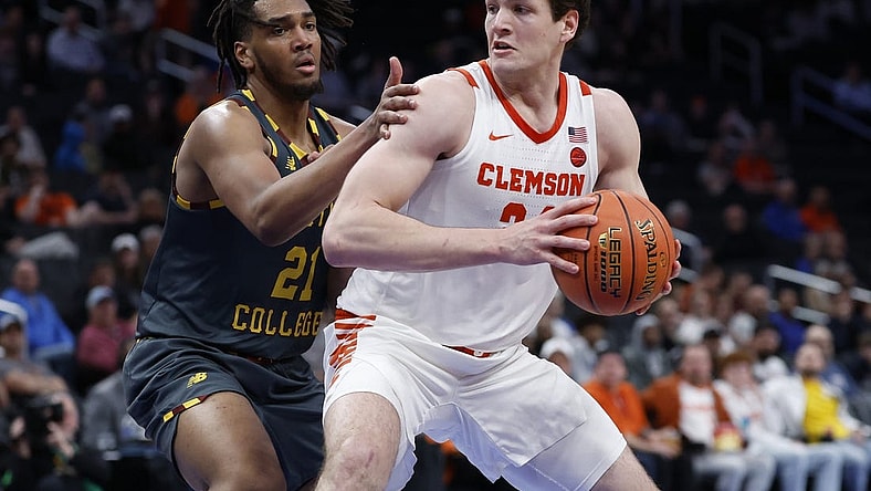 Mar 13, 2024; Washington, D.C., USA; Clemson Tigers center PJ Hall (24) drives to the basket as Boston College Eagles forward Devin McGlockton (21) defends in the second half at Capital One Arena. Mandatory Credit: Geoff Burke-USA TODAY Sports