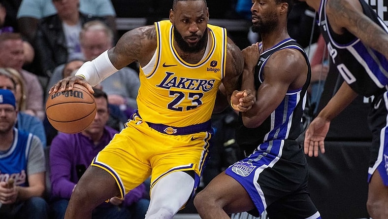 Mar 13, 2024; Sacramento, California, USA; Sacramento Kings forward Harrison Barnes (40) defends against Los Angeles Lakers forward LeBron James (23) during the fourth quarter at Golden 1 Center. Mandatory Credit: Ed Szczepanski-USA TODAY Sports