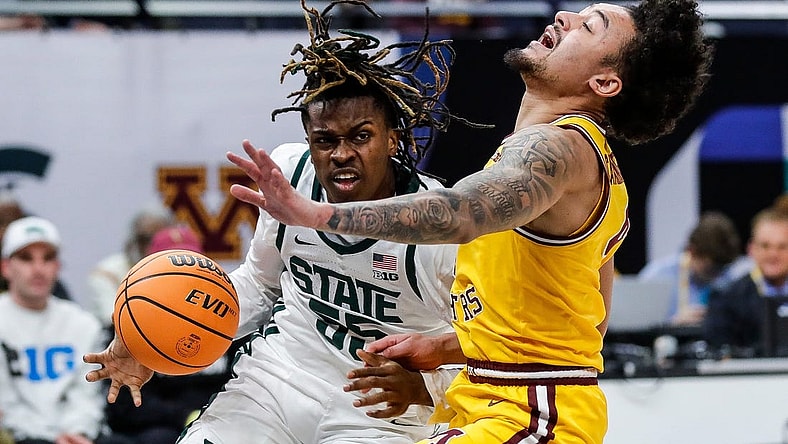 Michigan State forward Coen Carr (55) dribbles against Minnesota guard Braeden Carrington (4) during the first half of Second Round of Big Ten tournament at Target Center in Minneapolis, Minn. on Thursday, March 14, 2024.