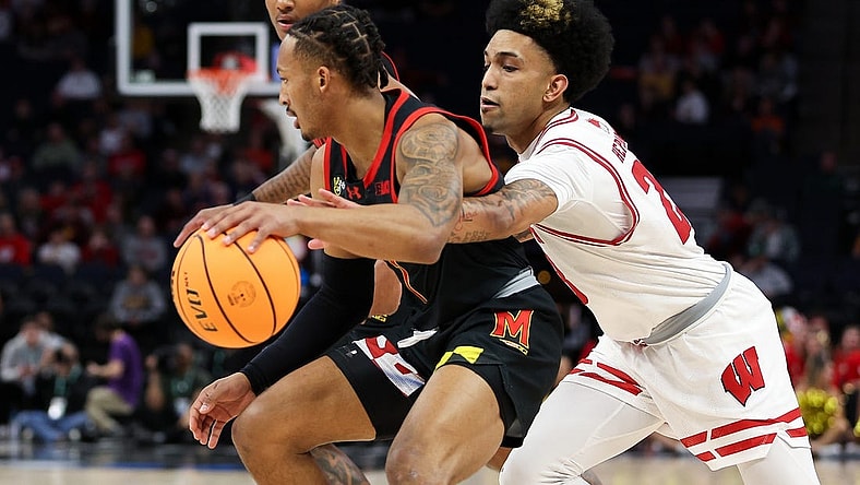 Mar 14, 2024; Minneapolis, MN, USA; Maryland Terrapins guard Jahmir Young (1) dribbles as Wisconsin Badgers guard Chucky Hepburn (23) defends during the first half at Target Center. Mandatory Credit: Matt Krohn-USA TODAY Sports