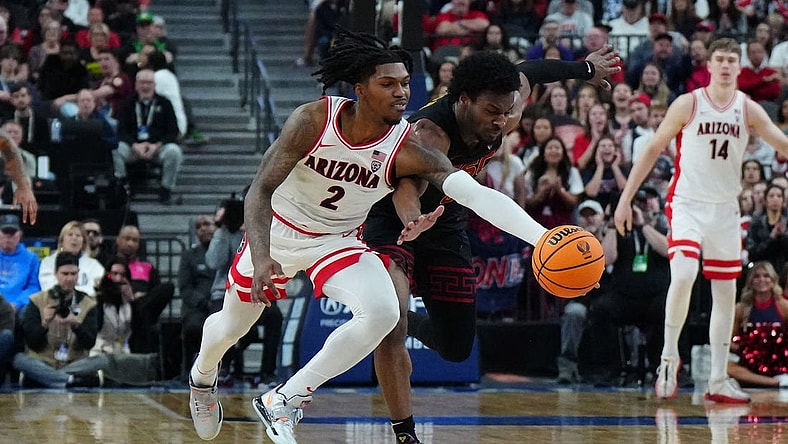 Mar 14, 2024; Las Vegas, NV, USA; Arizona Wildcats guard Caleb Love (2) and Southern California Trojans guard Bronny James (6) battle for the ball in the first half at T-Mobile Arena. Mandatory Credit: Kirby Lee-USA TODAY Sports