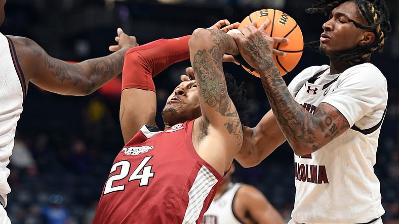 Mar 14, 2024; Nashville, TN, USA; Arkansas Razorbacks guard Jeremiah Davenport (24) tries to grab a rebound against South Carolina Gamecocks guard Zachary Davis (12) during the first half at Bridgestone Arena. Mandatory Credit: Christopher Hanewinckel-USA TODAY Sports