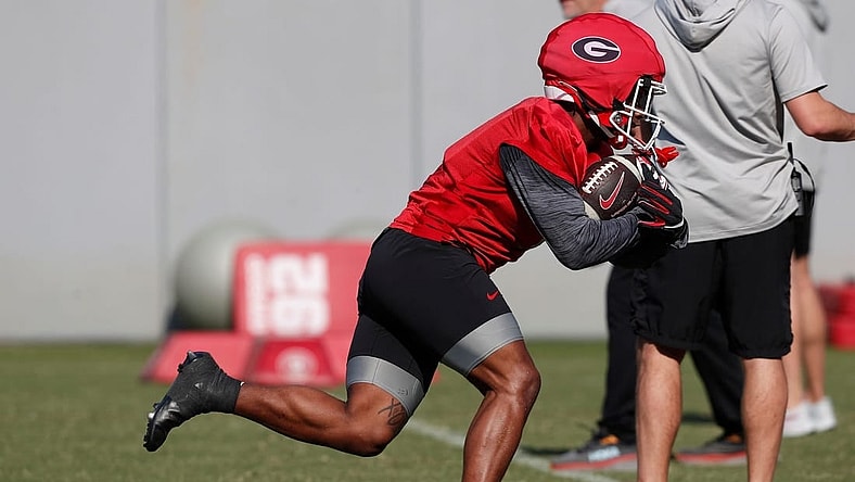 Georgia running back Trevor Etienne (1) runs a drill during spring practice in Athens, Ga., on Thursday, March 14, 2024.