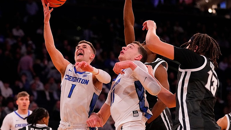 Mar 14, 2024; New York City, NY, USA;  Creighton Bluejays guard Steven Ashworth (1) shoots over the Providence Friars defense during the first half at Madison Square Garden. Mandatory Credit: Robert Deutsch-USA TODAY Sports