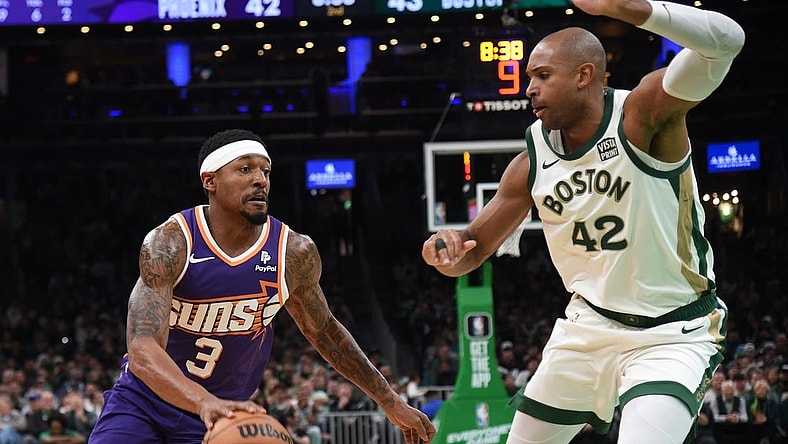 Mar 14, 2024; Boston, Massachusetts, USA;  Phoenix Suns guard Bradley Beal (3) controls the ball while Boston Celtics center Al Horford (42) defends during the first half at TD Garden. Mandatory Credit: Bob DeChiara-USA TODAY Sports