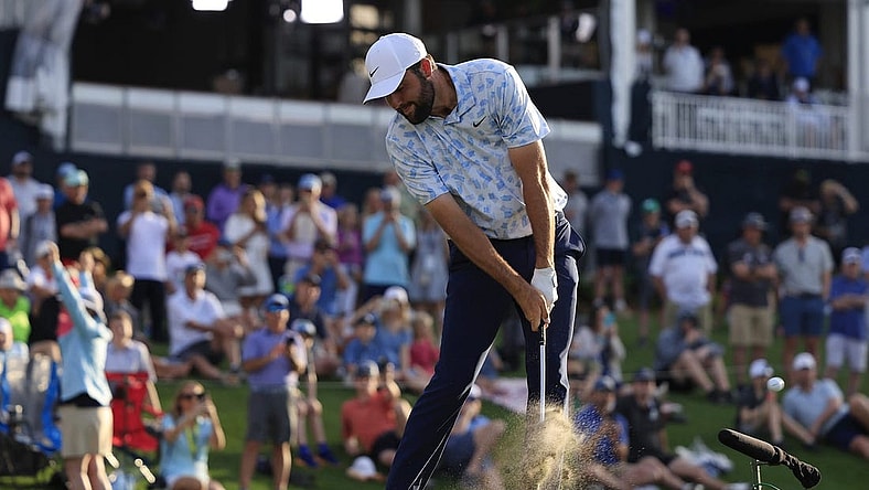 Scottie Scheffler tees off on hole 17 during the first round of The Players Championship PGA golf tournament Thursday, March 14, 2024 at TPC Sawgrass in Ponte Vedra Beach, Fla.