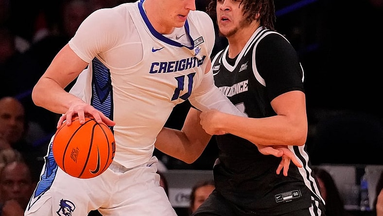 Mar 14, 2024; New York City, NY, USA;  Creighton Bluejays center Ryan Kalkbrenner (11) and Providence Friars forward Josh Oduro (13) square off during the second half at Madison Square Garden. Mandatory Credit: Robert Deutsch-USA TODAY Sports