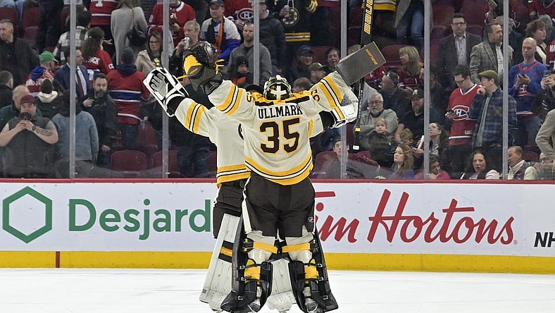Mar 14, 2024; Montreal, Quebec, CAN; Boston Bruins goalie Linus Ullmark (35) celebrates with teammate goalie Jeremy Swayman (1) the win against the Montreal Canadiens in overtime at the Bell Centre. Mandatory Credit: Eric Bolte-USA TODAY Sports