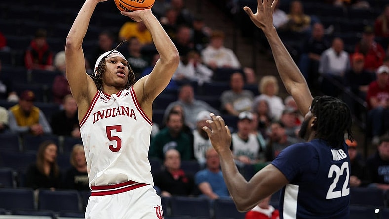 Mar 14, 2024; Minneapolis, MN, USA; Indiana Hoosiers forward Malik Reneau (5) shoots as Penn State Nittany Lions forward Qudus Wahab (22) defends during the first half at Target Center. Mandatory Credit: Matt Krohn-USA TODAY Sports
