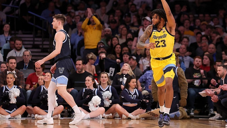 Mar 14, 2024; New York City, NY, USA; Marquette Golden Eagles forward David Joplin (23) celebrates his three point shot against Villanova Wildcats guard Brendan Hausen (1) during the first half at Madison Square Garden. Mandatory Credit: Brad Penner-USA TODAY Sports