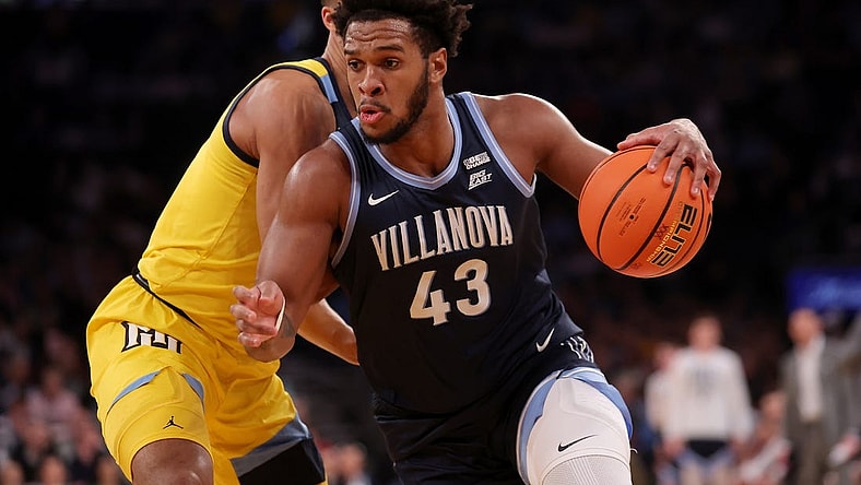 Mar 14, 2024; New York City, NY, USA; Villanova Wildcats forward Eric Dixon (43) drives to the basket against Marquette Golden Eagles forward Oso Ighodaro (13) during the first half at Madison Square Garden. Mandatory Credit: Brad Penner-USA TODAY Sports