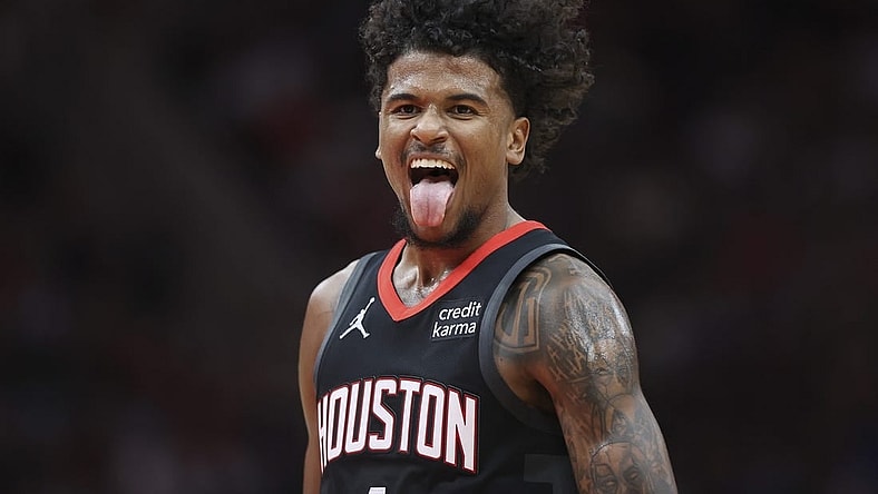 Mar 14, 2024; Houston, Texas, USA; Houston Rockets guard Jalen Green (4) reacts after making a basket during the third quarter against the Washington Wizards at Toyota Center. Mandatory Credit: Troy Taormina-USA TODAY Sports