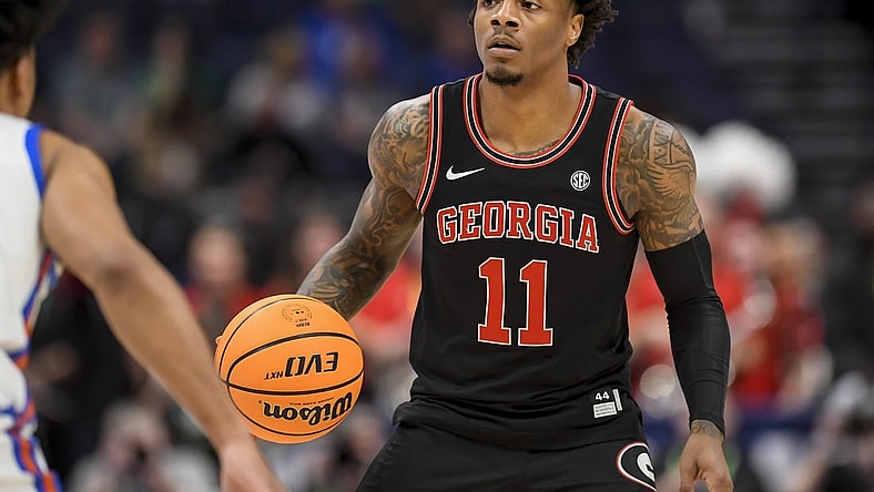 Mar 14, 2024; Nashville, TN, USA;  Georgia Bulldogs guard Justin Hill (11) dribbles against the Florida Gators during the first half at Bridgestone Arena. Mandatory Credit: Steve Roberts-USA TODAY Sports