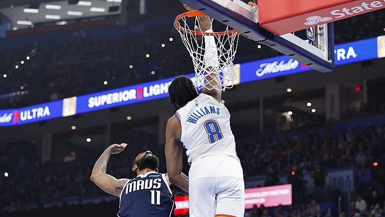 Mar 14, 2024; Oklahoma City, Oklahoma, USA; Oklahoma City Thunder forward Jalen Williams (8) blocks a shot by Dallas Mavericks guard Kyrie Irving (11) during the first half at Paycom Center. Mandatory Credit: Alonzo Adams-USA TODAY Sports
