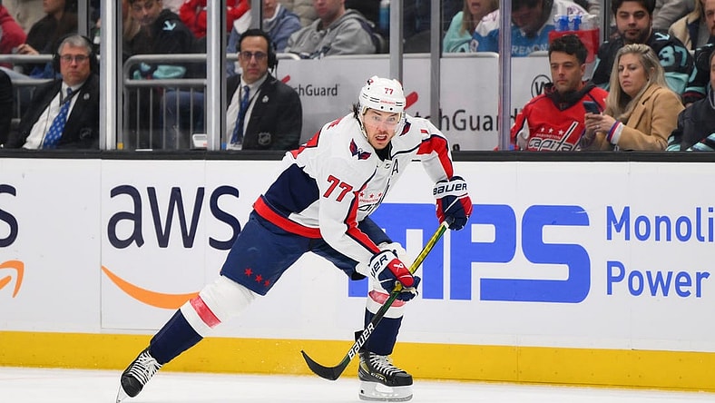 Mar 14, 2024; Seattle, Washington, USA; Washington Capitals right wing T.J. Oshie (77) plays the puck during the third period against the Seattle Kraken at Climate Pledge Arena. Mandatory Credit: Steven Bisig-USA TODAY Sports