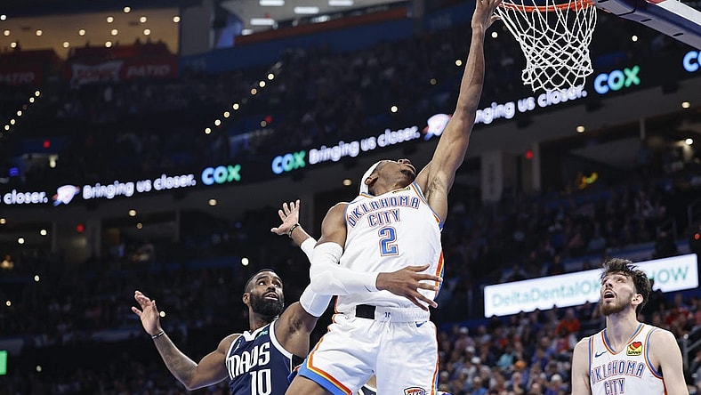 Mar 14, 2024; Oklahoma City, Oklahoma, USA; Oklahoma City Thunder guard Shai Gilgeous-Alexander (2) lays up a shot in front of Dallas Mavericks forward Tim Hardaway Jr. (10) during the second half at Paycom Center. Mandatory Credit: Alonzo Adams-USA TODAY Sports
