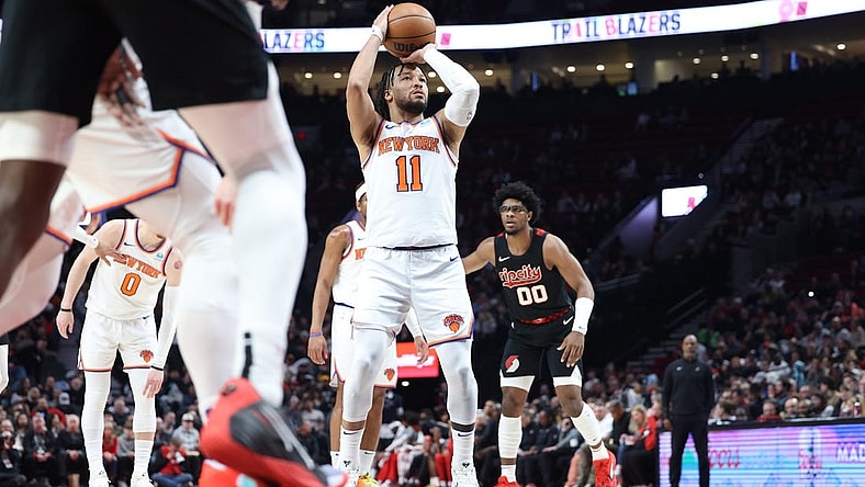 Mar 14, 2024; Portland, Oregon, USA; New York Knicks guard Jalen Brunson (11) shoots a free throw as Portland Trail Blazers guard Scoot Henderson (00) watches in the fourth quarter at Moda Center. Mandatory Credit: Jaime Valdez-USA TODAY Sports
