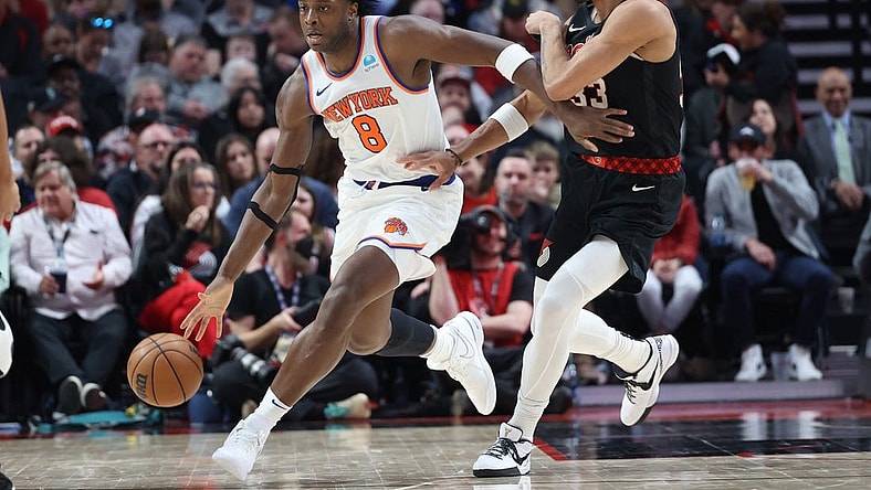 Mar 14, 2024; Portland, Oregon, USA;  New York Knicks forward OG Anunoby (8) controls the ball against Portland Trail Blazers forward Toumani Camara (33) in the fourth quarter at Moda Center. Mandatory Credit: Jaime Valdez-USA TODAY Sports