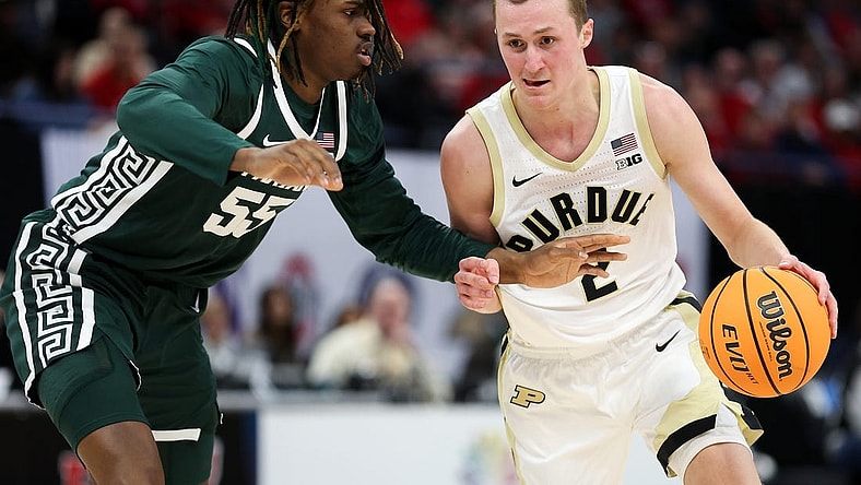 Mar 15, 2024; Minneapolis, MN, USA; Purdue Boilermakers guard Fletcher Loyer (2) works around Michigan State Spartans forward Coen Carr (55) during the first half at Target Center. Mandatory Credit: Matt Krohn-USA TODAY Sports