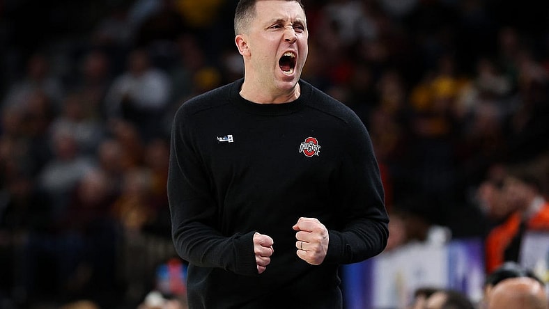 Mar 15, 2024; Minneapolis, MN, USA; Ohio State Buckeyes head coach Jake Diebler celebrates during the first half against the Illinois Fighting Illini at Target Center. Mandatory Credit: Matt Krohn-USA TODAY Sports