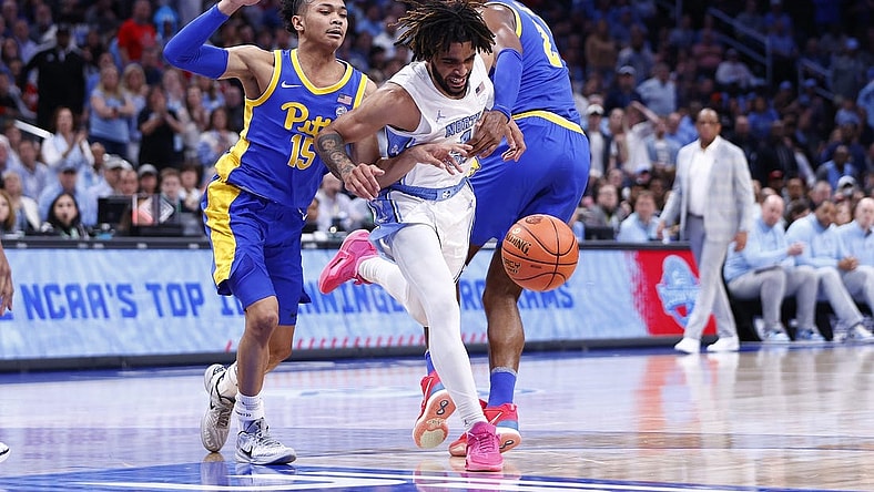 Mar 15, 2024; Washington, D.C., USA; North Carolina Tar Heels guard RJ Davis (4) looses control of the ball as Pittsburgh Panthers guard Jaland Lowe (15) and Panthers forward Blake Hinson (2) defend during the first half at Capital One Arena. Mandatory Credit: Amber Searls-USA TODAY Sports