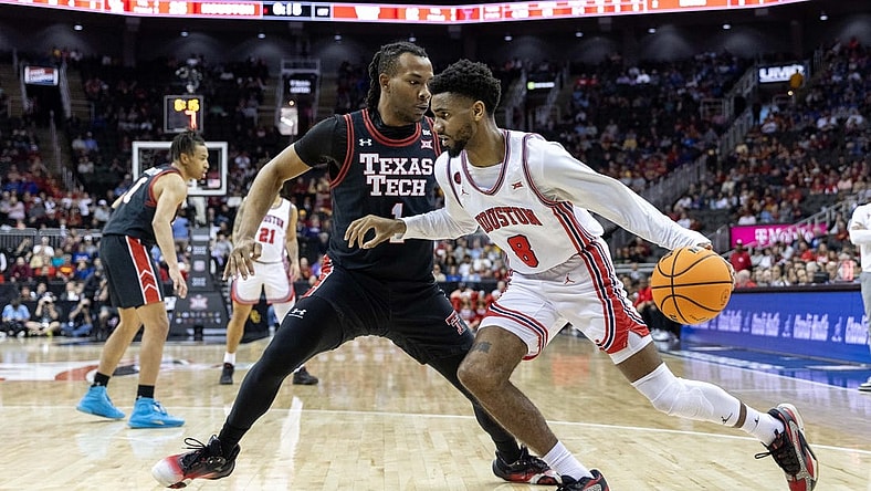 Mar 15, 2024; Kansas City, MO, USA; Houston Cougars guard Mylik Wilson (8) drives around Texas Tech Red Raiders guard Lamar Washington (1) during the first half at T-Mobile Center. Mandatory Credit: William Purnell-USA TODAY Sports