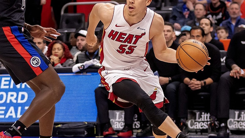 Mar 15, 2024; Detroit, Michigan, USA; Miami Heat forward Duncan Robinson (55) dribbles the ball against the Detroit Pistons during the first quarter at Little Caesars Arena. Mandatory Credit: David Reginek-USA TODAY Sports