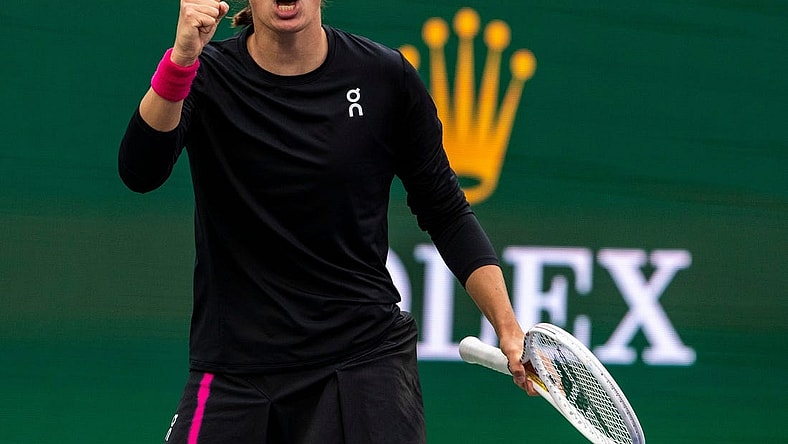 Iga Swiatek celebrates winning the fifth game of the second set against Marta Kostyuk during the WTA semifinals of the BNP Paribas Open in Indian Wells, Calif., Friday, March 15, 2024.