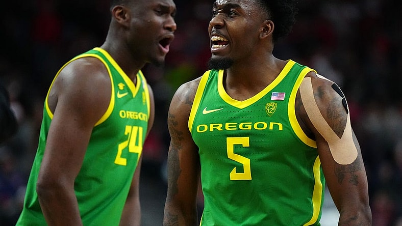 Mar 15, 2024; Las Vegas, NV, USA; Oregon Ducks guard Jermaine Couisnard (5) and forward Mahamadou Diawara (24) celebrate against the Arizona Wildcats in the second half at T-Mobile Arena. Mandatory Credit: Kirby Lee-USA TODAY Sports