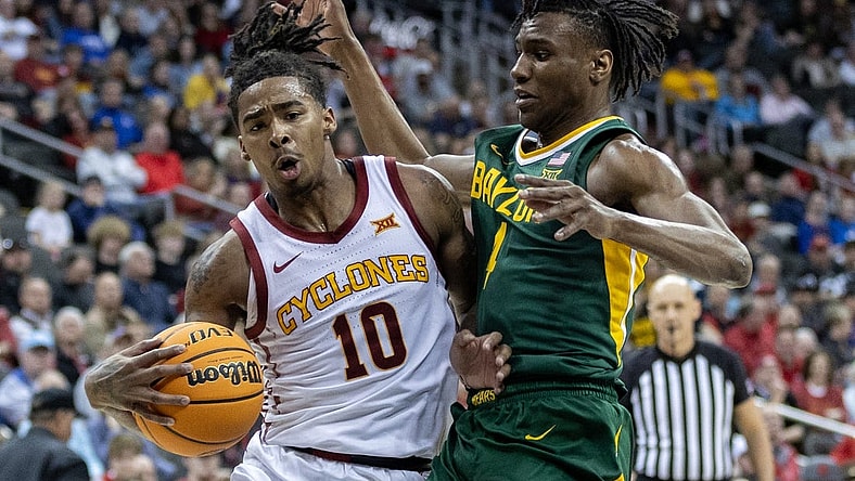Mar 15, 2024; Kansas City, MO, USA; Iowa State Cyclones guard Keshon Gilbert (10) drives around Baylor Bears guard Ja'Kobe Walter (4) during the first half at T-Mobile Center. Mandatory Credit: William Purnell-USA TODAY Sports