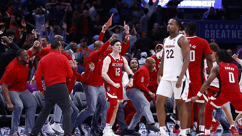 Mar 15, 2024; Washington, D.C., USA; North Carolina State Wolfpack guard Michael O'Connell (12) celebrates after shooting a three point shot at the buzzer during the second half against the Virginia Cavaliers at Capital One Arena. Mandatory Credit: Amber Searls-USA TODAY Sports